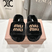 MIUMIU 26S FLAT SLIDES IN BLACK SHEARLING
