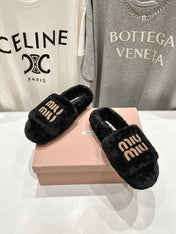 MIUMIU 26S FLAT SLIDES IN BLACK SHEARLING