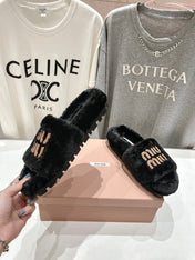 MIUMIU 26S FLAT SLIDES IN BLACK SHEARLING