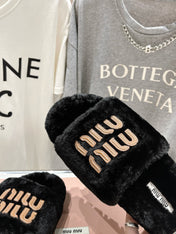 MIUMIU 26S FLAT SLIDES IN BLACK SHEARLING