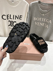 MIUMIU 26S FLAT SLIDES IN BLACK SHEARLING