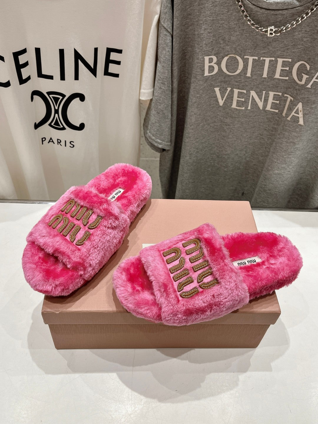 MIUMIU 26S FLAT SLIDES IN PINK SHEARLING