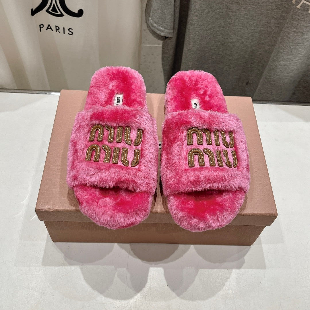 MIUMIU 26S FLAT SLIDES IN PINK SHEARLING