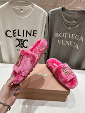 MIUMIU 26S FLAT SLIDES IN PINK SHEARLING