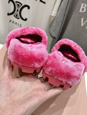 MIUMIU 26S FLAT SLIDES IN PINK SHEARLING