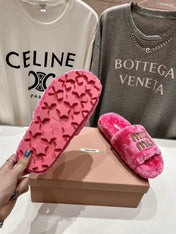 MIUMIU 26S FLAT SLIDES IN PINK SHEARLING