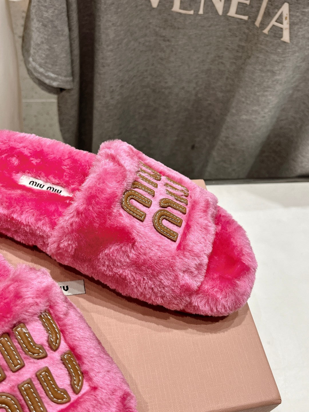 MIUMIU 26S FLAT SLIDES IN PINK SHEARLING