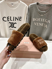 MIUMIU 26S FLAT SLIDES IN BROWN SHEARLING