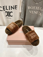 MIUMIU 26S FLAT SLIDES IN BROWN SHEARLING