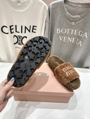 MIUMIU 26S FLAT SLIDES IN BROWN SHEARLING