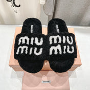 MIUMIU 26S SANDALS IN BLACK SHEARLING WITH LOGO LETTERING
