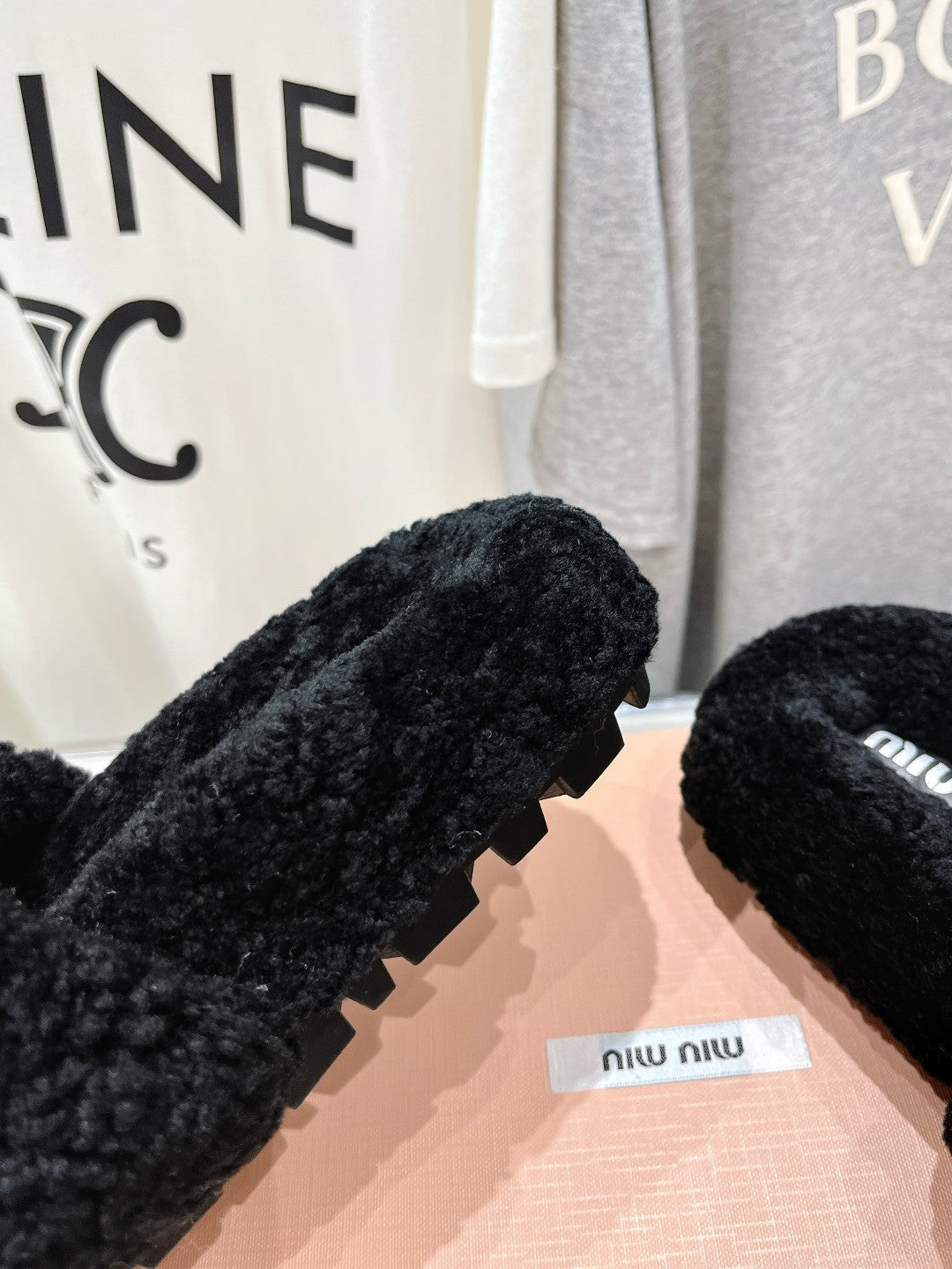 MIUMIU 26S SANDALS IN BLACK SHEARLING WITH LOGO LETTERING