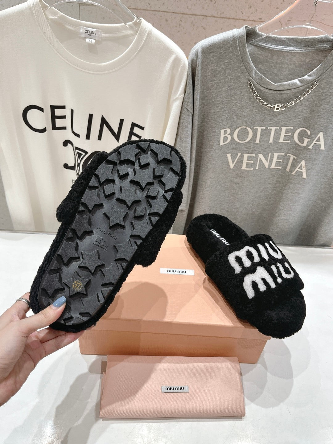 MIUMIU 26S SANDALS IN BLACK SHEARLING WITH LOGO LETTERING