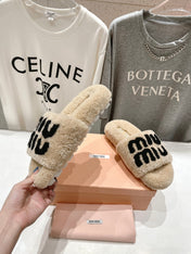 MIUMIU 26S SANDALS IN BEIGE SHEARLING WITH LOGO LETTERING