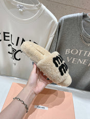 MIUMIU 26S SANDALS IN BEIGE SHEARLING WITH LOGO LETTERING