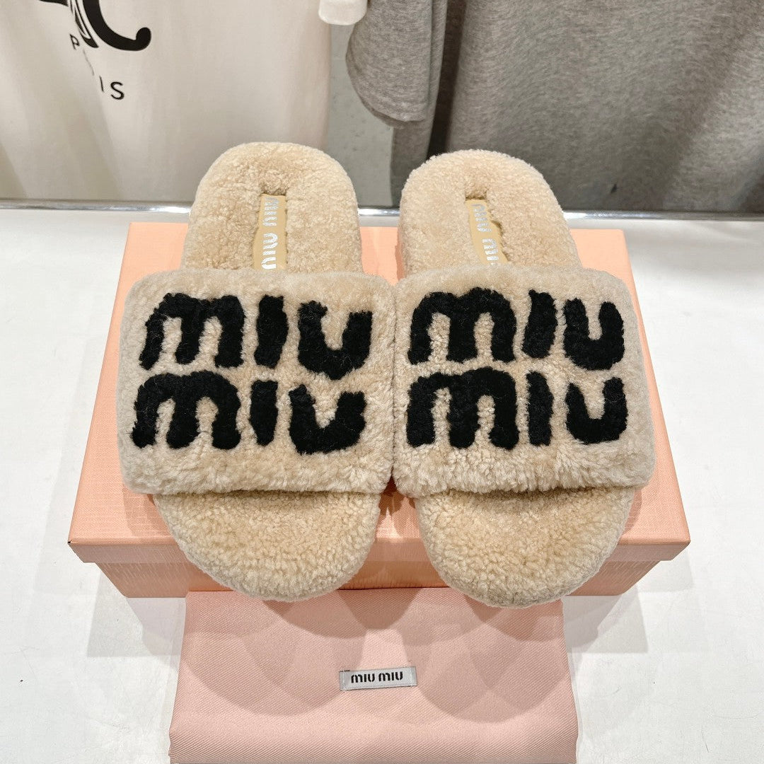MIUMIU 26S SANDALS IN BEIGE SHEARLING WITH LOGO LETTERING