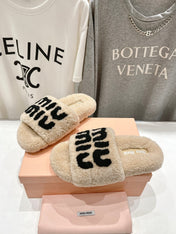 MIUMIU 26S SANDALS IN BEIGE SHEARLING WITH LOGO LETTERING