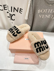 MIUMIU 26S SANDALS IN BEIGE SHEARLING WITH LOGO LETTERING