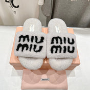 MIUMIU 26S SANDALS IN CREAM WHITE SHEARLING WITH LOGO LETTERING