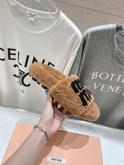 MIUMIU 26S SANDALS IN LIGHT BROWN SHEARLING WITH LOGO LETTERING