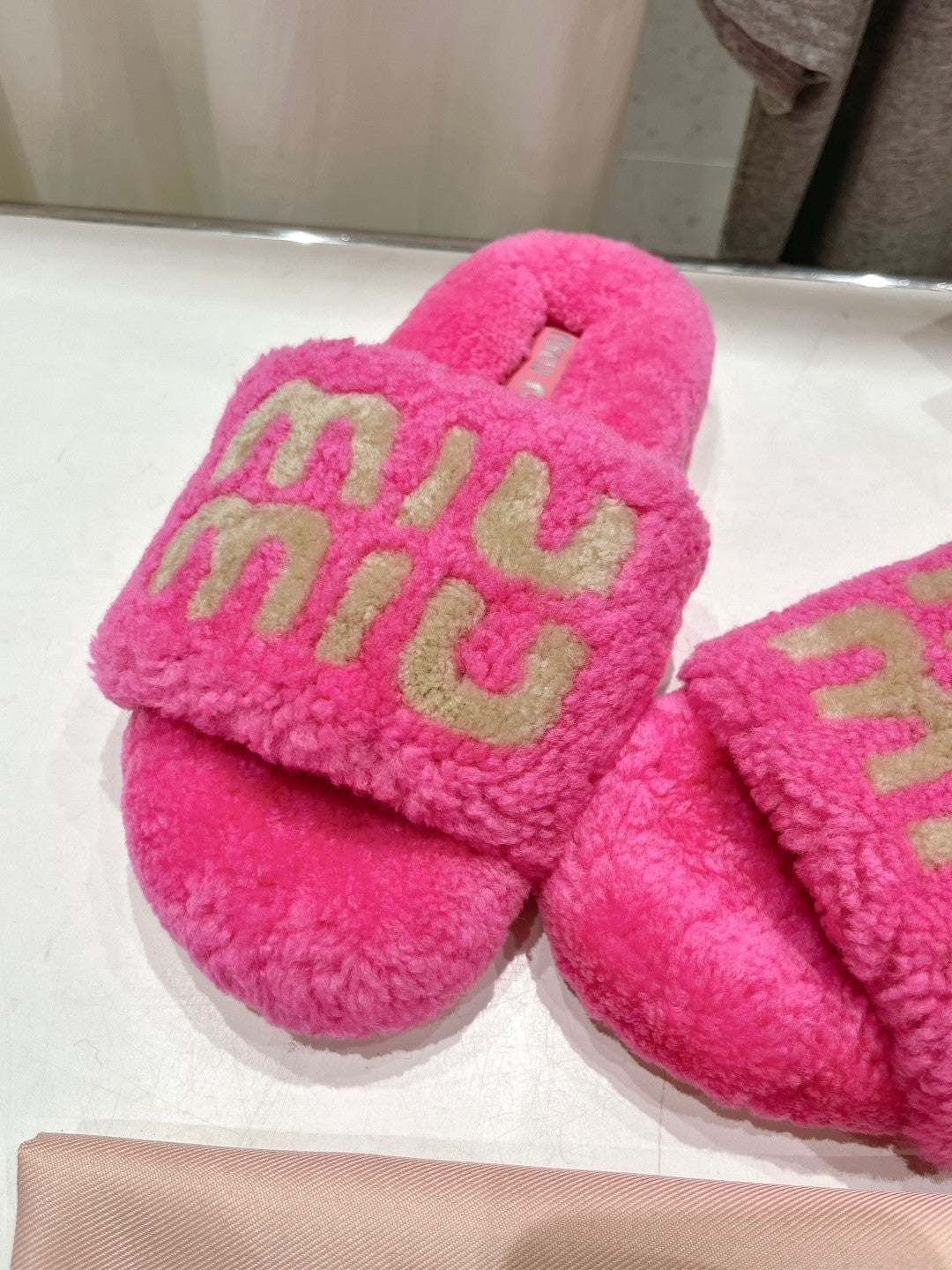 MIUMIU 26S SANDALS IN PINK SHEARLING WITH LOGO LETTERING
