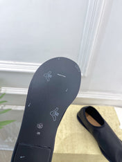 THE ROW 26S SLIP-ON FLATS IN BLACK NAPPA CALFSKIN