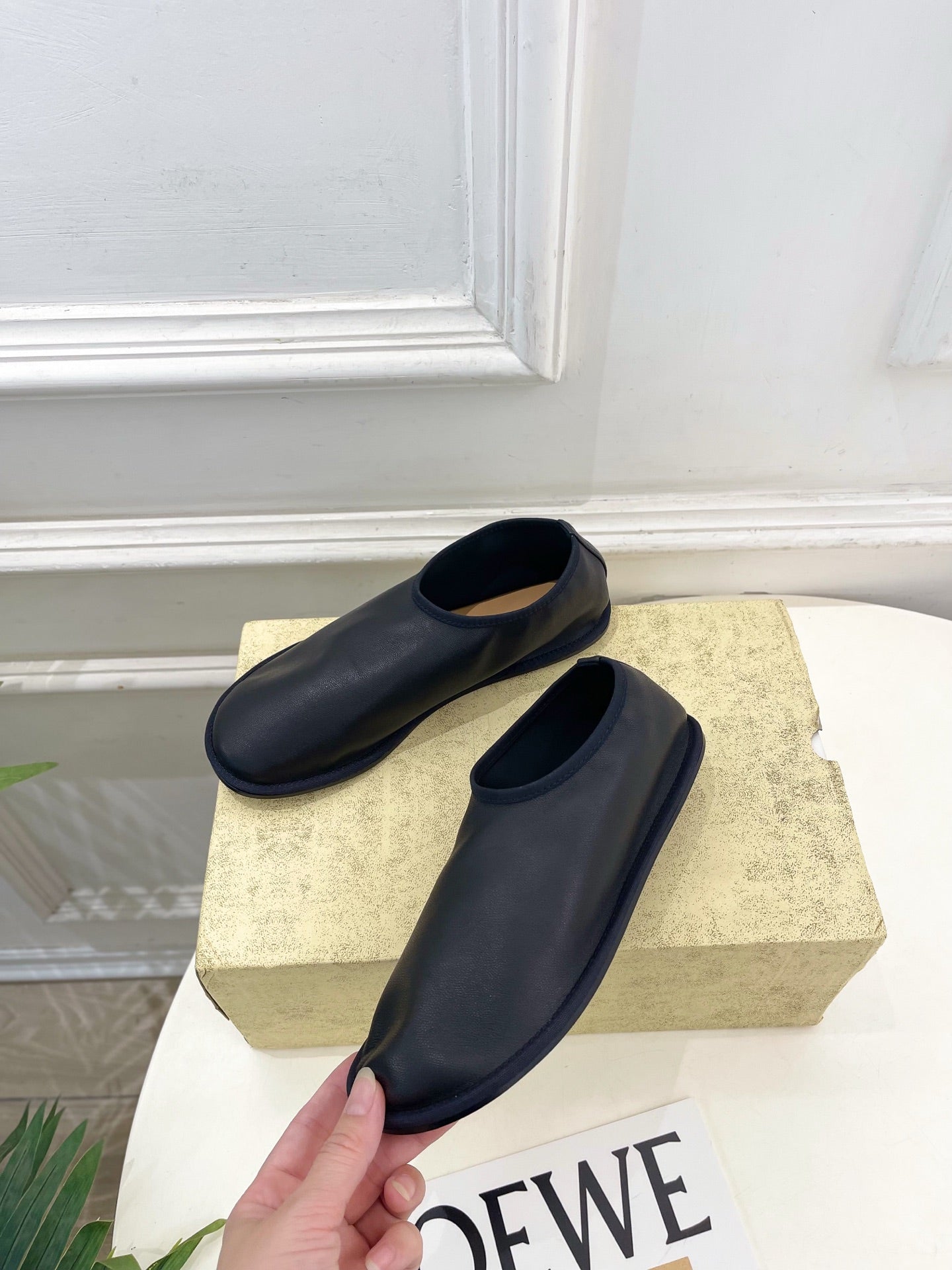 THE ROW 26S SLIP-ON FLATS IN BLACK NAPPA CALFSKIN