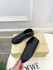 THE ROW 26S SLIP-ON FLATS IN BLACK NAPPA CALFSKIN