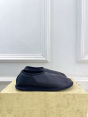 THE ROW 26S SLIP-ON FLATS IN BLACK NAPPA CALFSKIN