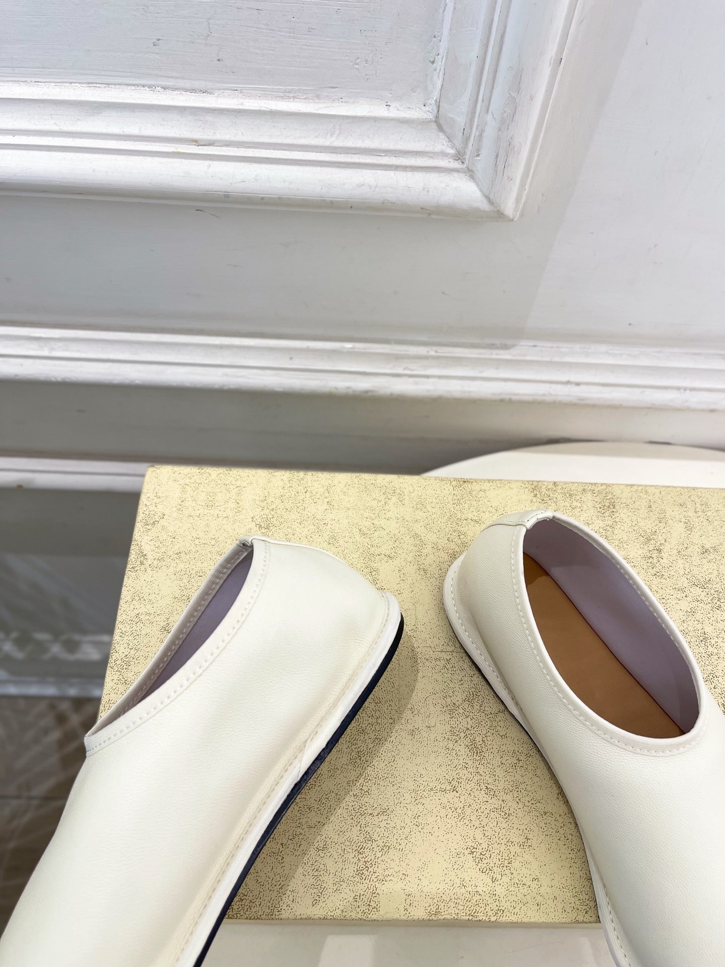 THE ROW 26S SLIP-ON FLATS IN WHITE NAPPA CALFSKIN