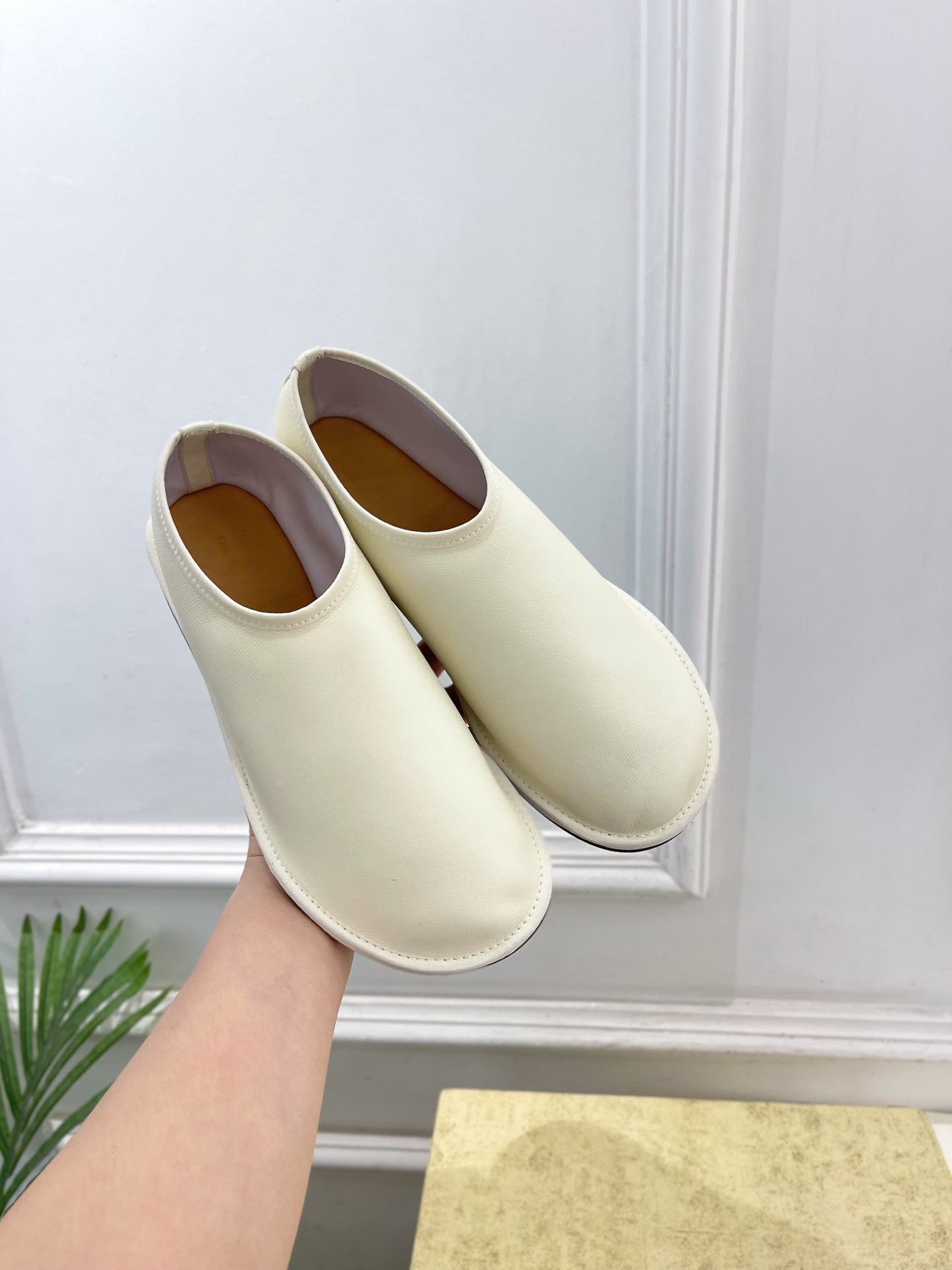 THE ROW 26S SLIP-ON FLATS IN WHITE NAPPA CALFSKIN
