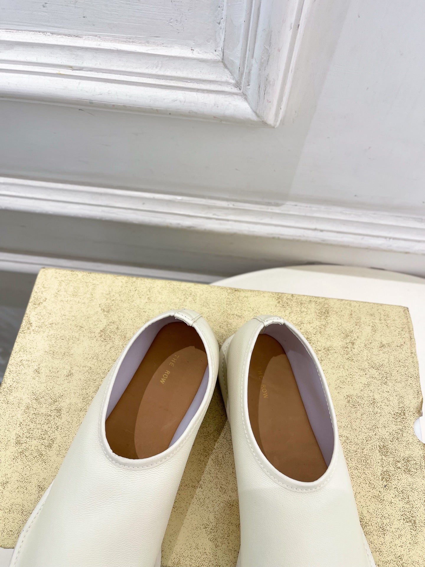 THE ROW 26S SLIP-ON FLATS IN WHITE NAPPA CALFSKIN