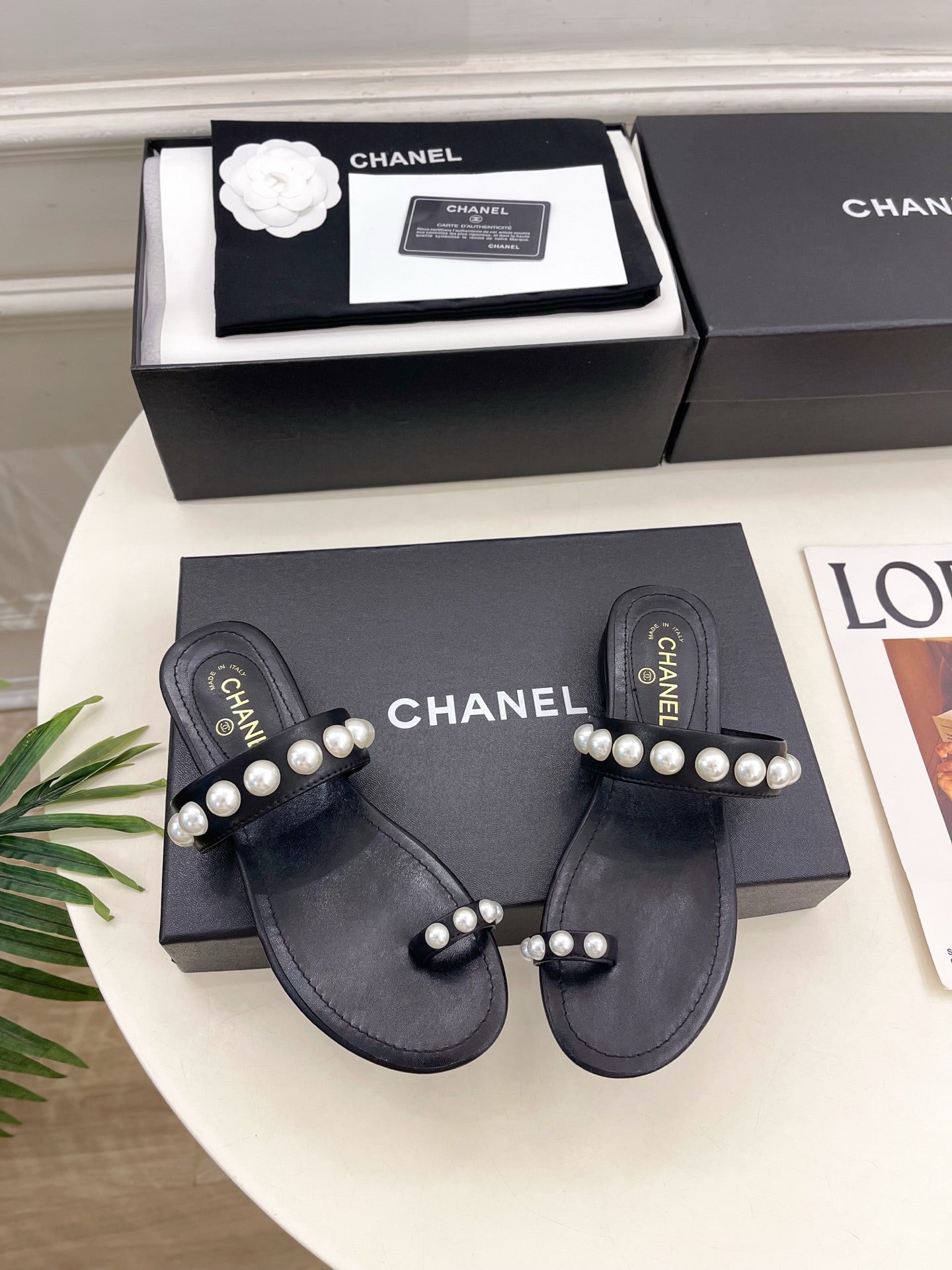 CHANEL 26S THONG SANDALS IN BLACK LAMBSKIN WITH PEARL EMBELLISHMENTS