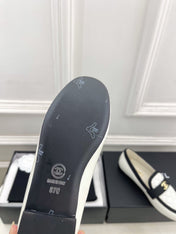 CHANEL 26S LOAFER MULES IN WHITE LAMBSKIN AND BLACK FABRIC