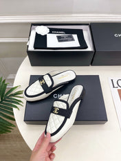 CHANEL 26S MULES IN WHITE LAMBSKIN AND BLACK FABRIC