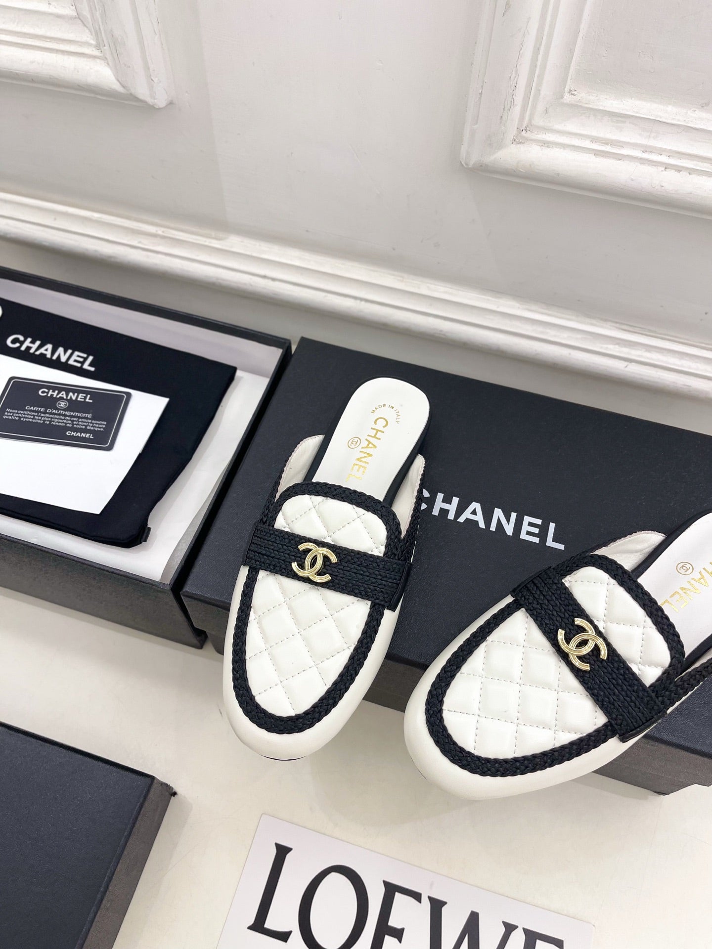 CHANEL 26S MULES IN WHITE LAMBSKIN AND BLACK FABRIC