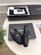 CHANEL 26S MULES IN BLACK LAMBSKIN AND TWEED