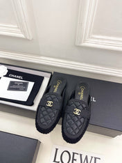 CHANEL 26S MULES IN BLACK LAMBSKIN AND TWEED