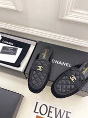 CHANEL 26S MULES IN BLACK LAMBSKIN AND TWEED