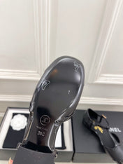 CHANEL 26S T STRAP MARY JANES IN BLACK PATENT AND LAMBSKIN